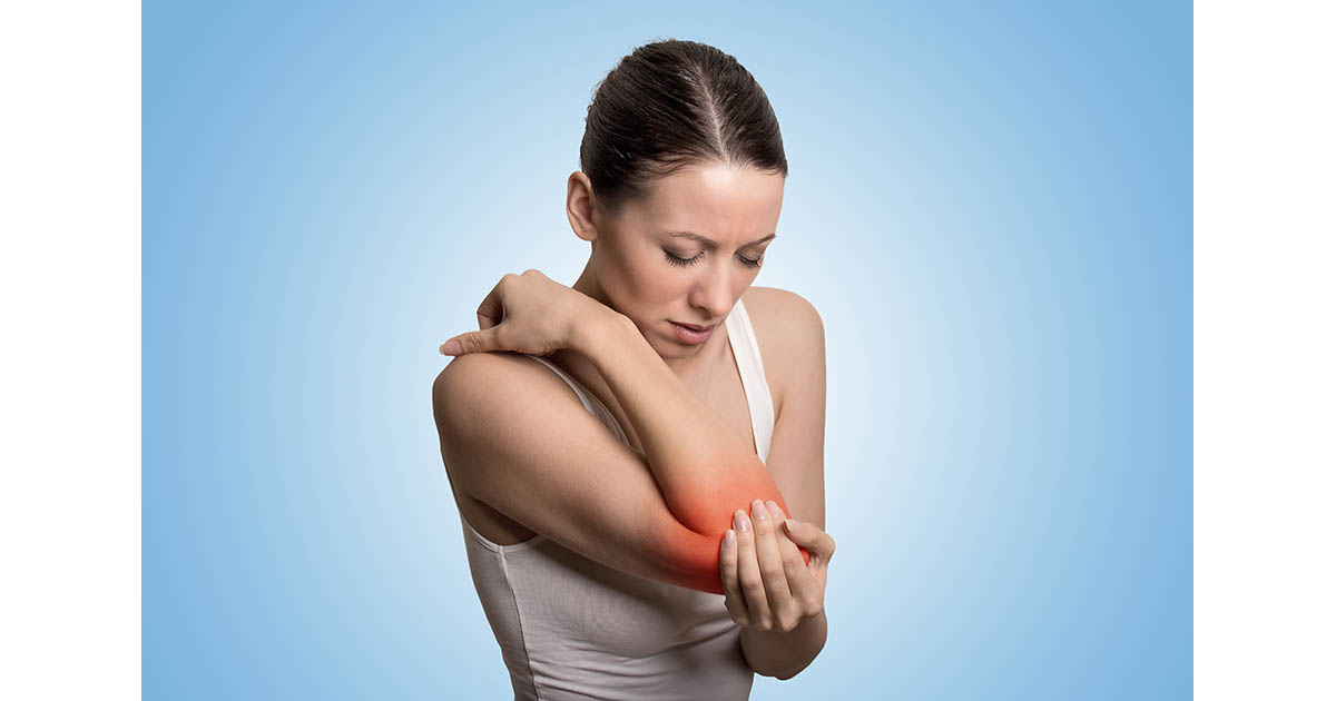 Woman holding her elbow with a red pain indicator at the joint, illustrating the nerve tenderness and inflammation of cubital tunnel syndrome