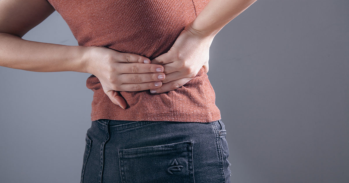 Spine and anatomy illustration showing the kidney and lumbar vertebrae regions where back pain and kidney pain can overlap
